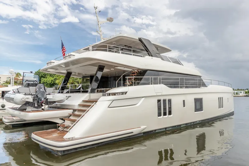Slide: The Image of Luxurious 2024 Sunreef 80 Power Cat yacht docked, showcasing sleek design and modern amenities. - 19