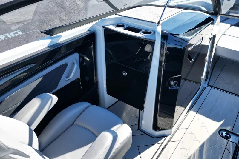 Slide: The Image of 2024 Yamaha Boats 255XE interior with sleek seating and modern console design. - 14