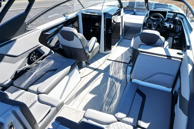 Slide: The Image of 2024 Yamaha Boats 255XE interior with modern seating and sleek design. - 12