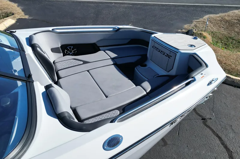 Slide: The Image of 2024 Yamaha Boats 255XE interior with sleek seating and modern design. - 7
