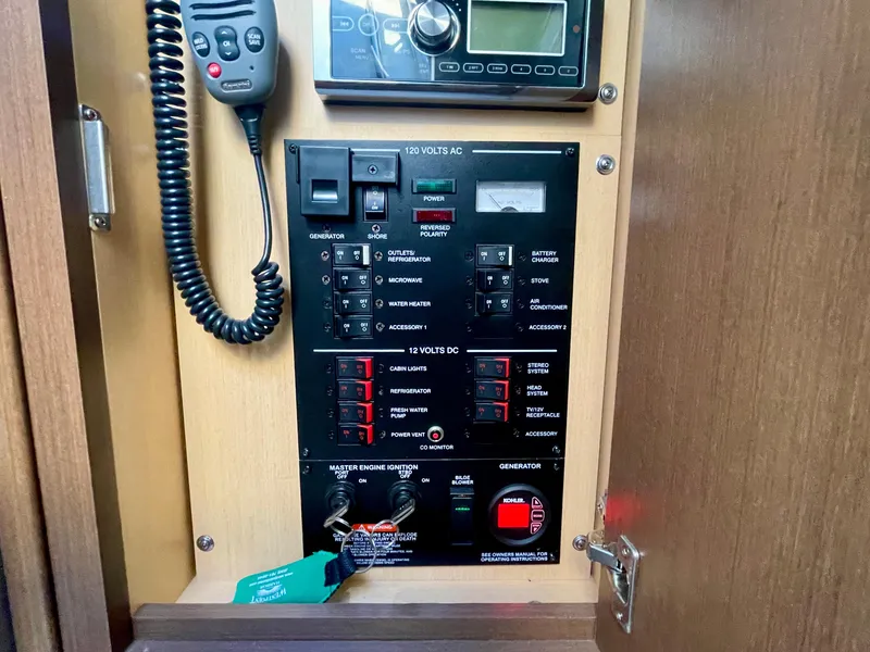 Slide: The Image of Electrical control panel on a 2014 Sea Ray 330 Sundancer boat. - 24
