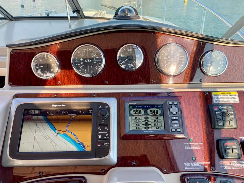 Slide: The Image of Dashboard of 2014 Sea Ray 330 Sundancer with navigation and control instruments. - 30