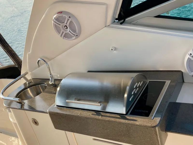 Slide: The Image of Outdoor kitchen on 2014 Sea Ray 330 Sundancer yacht with sink and grill. - 36