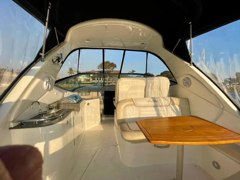 Slide: The Image of Interior of 2014 Sea Ray 330 Sundancer yacht with seating and table. - 43