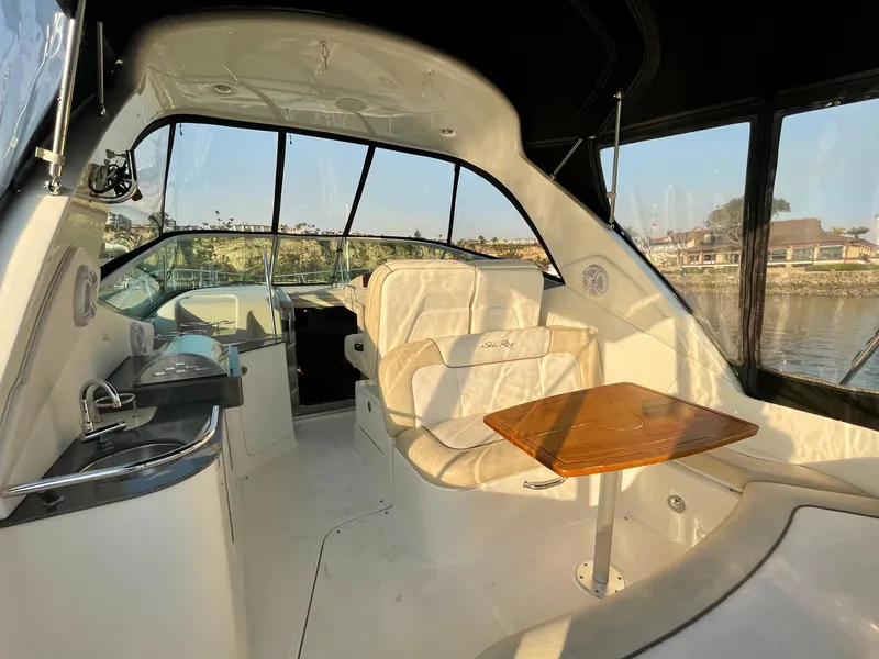 Slide: The Image of Interior of 2014 Sea Ray 330 Sundancer yacht with seating and table. - 49