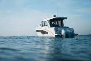 Slide: The Image of 2026 Beneteau Antares 9 boat on calm sea under clear sky. - 18