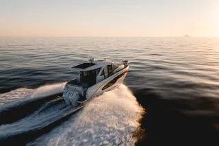 Slide: The Image of 2026 Beneteau Antares 9 cruising on open water at sunset. - 6
