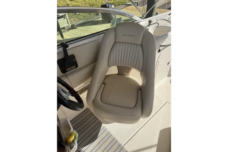 Slide: The Image of Beige captain's chair in 2003 Chaparral Sunesta 263 boat cockpit. - 3
