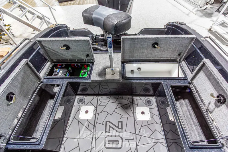 Slide: The Image of Interior view of 2026 Recon 895 DC boat with open storage compartments and seating. - 16