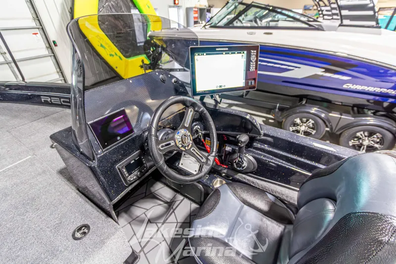 Slide: The Image of Interior of 2026 Recon 895 DC boat with modern steering and control panel. - 18