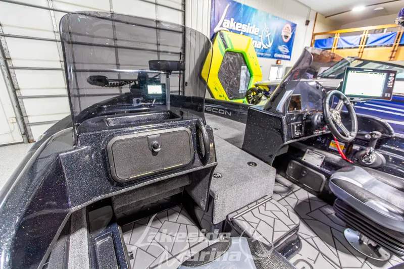 Slide: The Image of Interior of 2026 Recon 895 DC boat with modern dashboard and seating. - 22