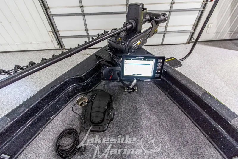 Slide: The Image of 2026 Recon 895 DC boat interior with advanced navigation system and trolling motor. - 31