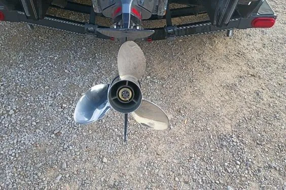Slide: The Image of 2020 Skeeter FXR21 boat propeller on gravel surface, rear view. - 6