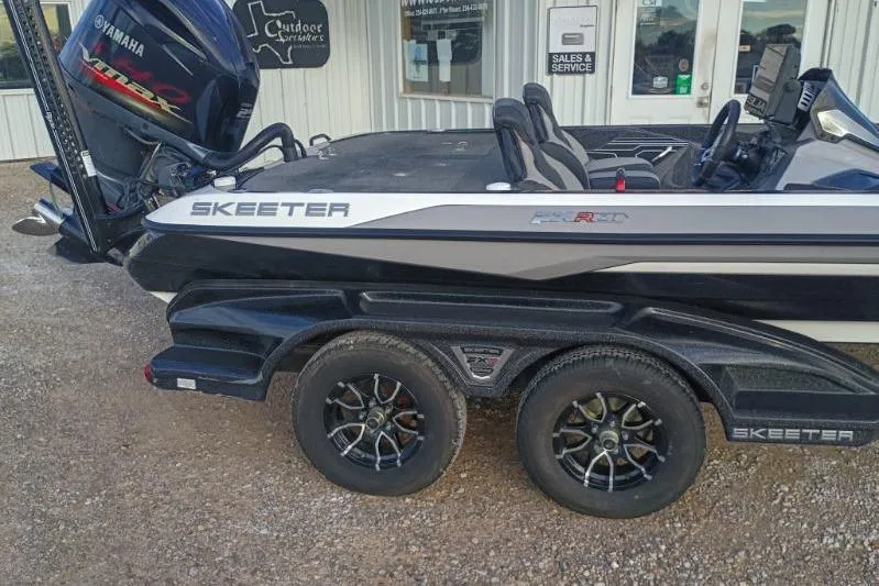 Slide: The Image of 2020 Skeeter FXR21 boat with Yamaha engine, parked outside sales and service center. - 7