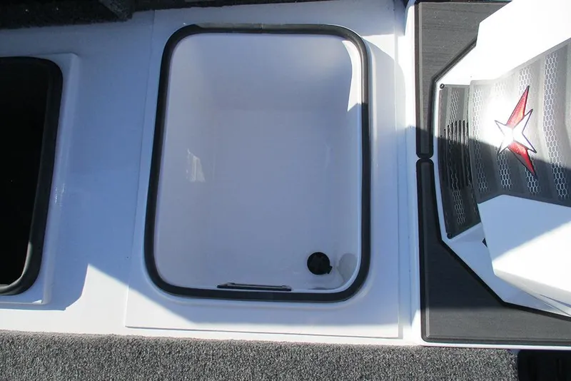 Slide: The Image of 2026 Vexus AVX 1980 boat storage compartment with star emblem detail. - 13