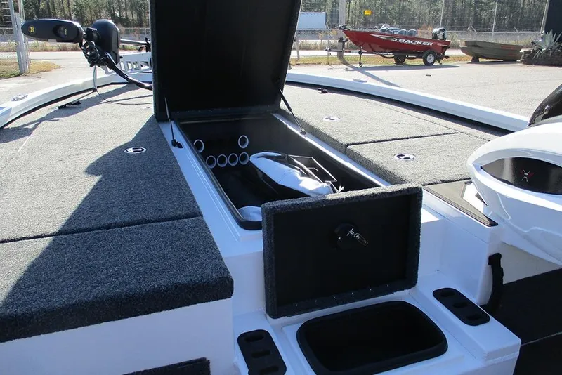 Slide: The Image of 2026 Vexus AVX 1980 boat with open storage compartments and fishing rod holders. - 18