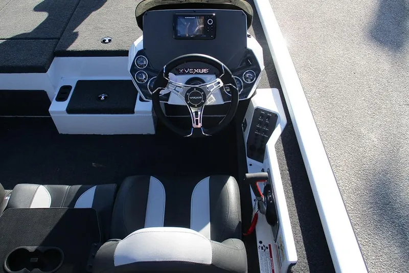 Slide: The Image of 2026 Vexus AVX 1980 boat cockpit with steering wheel and control panel. - 29
