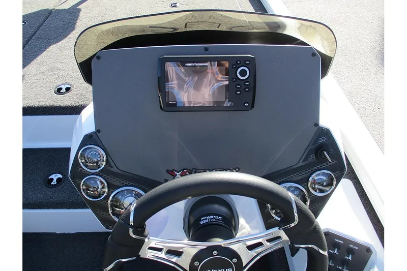 Slide: The Image of 2026 Vexus AVX 1980 boat dashboard with steering wheel and electronic display. - 30