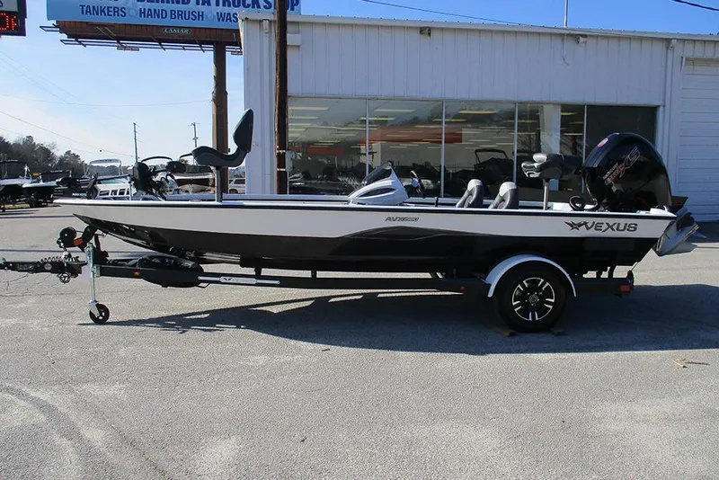Slide: The Image of 2026 Vexus AVX 1980 boat on trailer, parked outside dealership. - 6