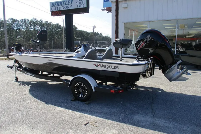 Slide: The Image of 2026 Vexus AVX 1980 boat on trailer outside dealership. - 7
