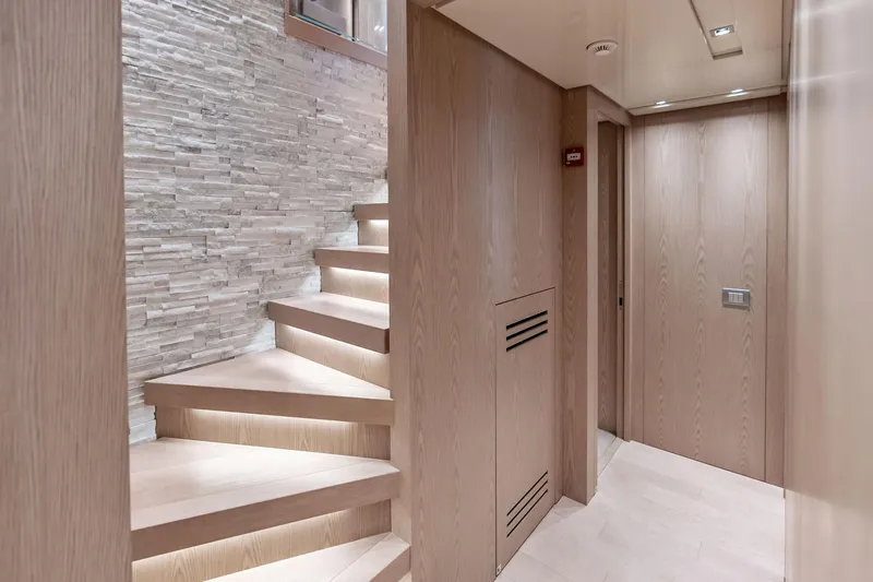 Slide: The Image of Luxurious interior of 2023 Sanlorenzo SD126 yacht with modern staircase and wood paneling. - 20