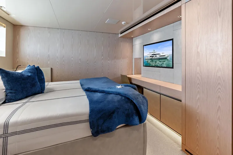 Slide: The Image of Luxurious Sanlorenzo SD126 2023 yacht bedroom with modern decor and wall-mounted TV. - 21