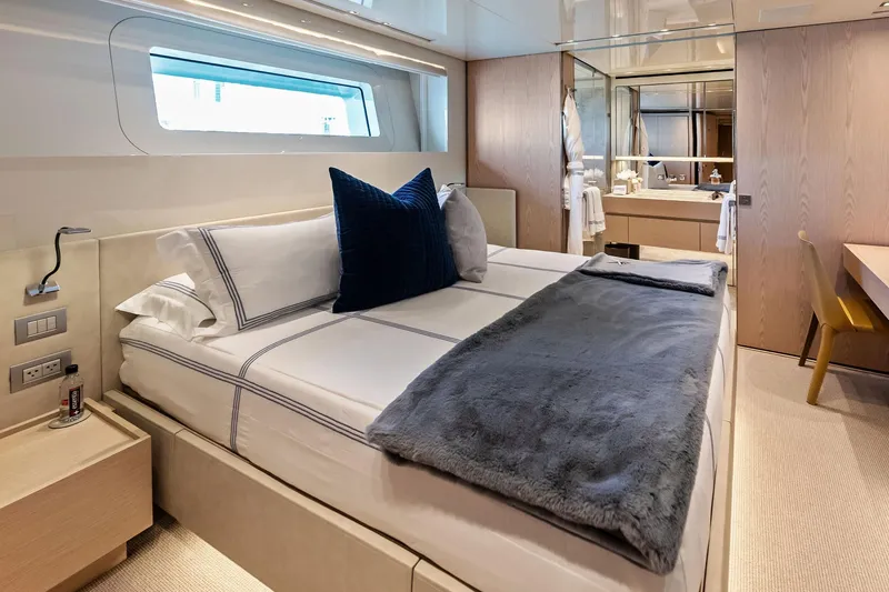 Slide: The Image of Luxurious bedroom interior on 2023 Sanlorenzo SD126 yacht, featuring elegant bedding and modern design. - 28