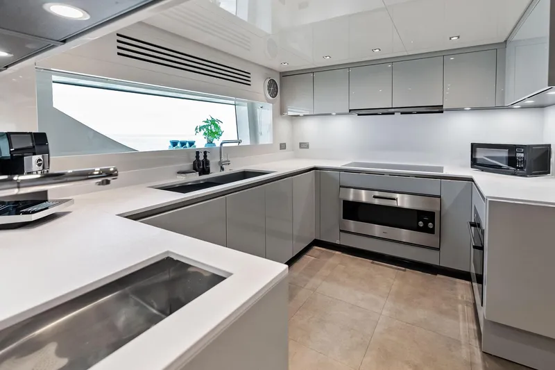 Slide: The Image of Modern kitchen interior on 2023 Sanlorenzo SD126 yacht, featuring sleek cabinetry and appliances. - 31