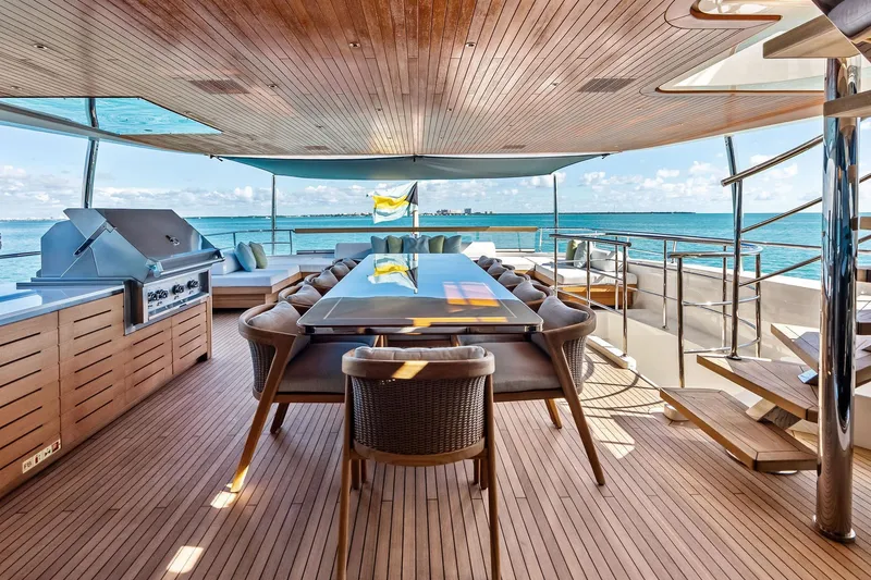 Slide: The Image of Luxurious 2023 Sanlorenzo SD126 yacht deck with dining area and ocean view. - 43