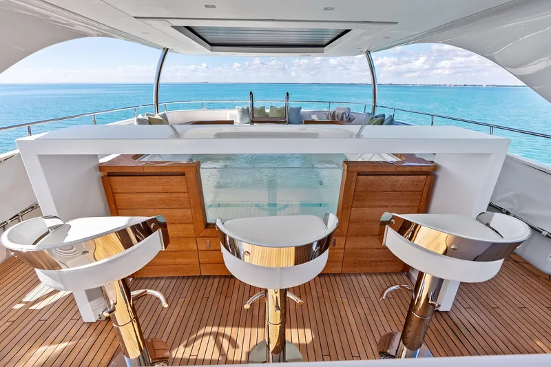 Slide: The Image of Luxurious 2023 Sanlorenzo SD126 yacht deck with bar stools and ocean view. - 51
