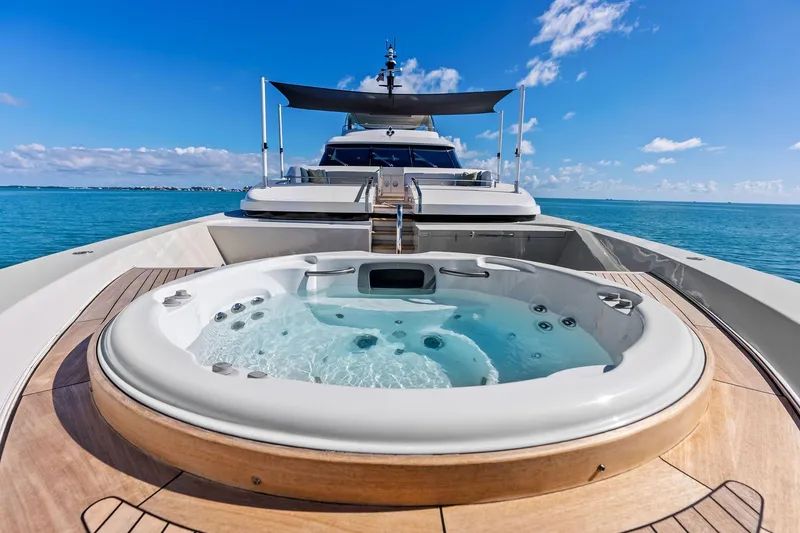 Slide: The Image of Luxurious 2023 Sanlorenzo SD126 yacht with jacuzzi on deck, cruising in clear blue waters. - 55