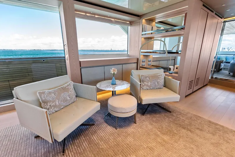 Slide: The Image of Luxurious 2023 Sanlorenzo SD126 yacht interior with elegant seating and ocean view. - 6