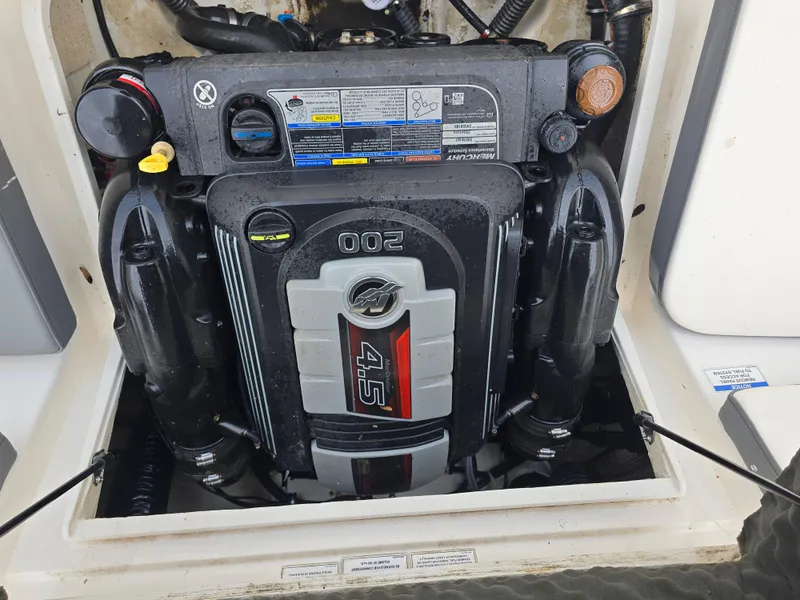 Slide: The Image of 2018 Bayliner VR4 Bowrider I/O engine compartment with 4.5L 200 HP engine. - 17