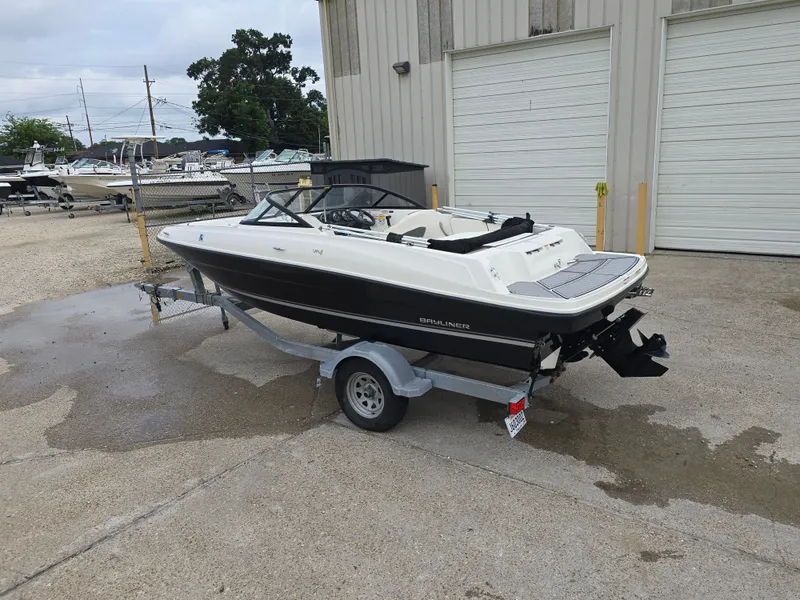 Slide: The Image of 2018 Bayliner VR4 Bowrider I/O on trailer, parked outside a storage facility. - 2