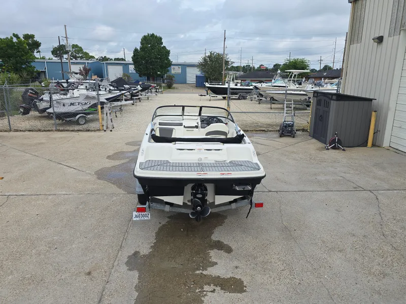 Slide: The Image of 2018 Bayliner VR4 Bowrider I/O boat parked in a marina lot. - 8