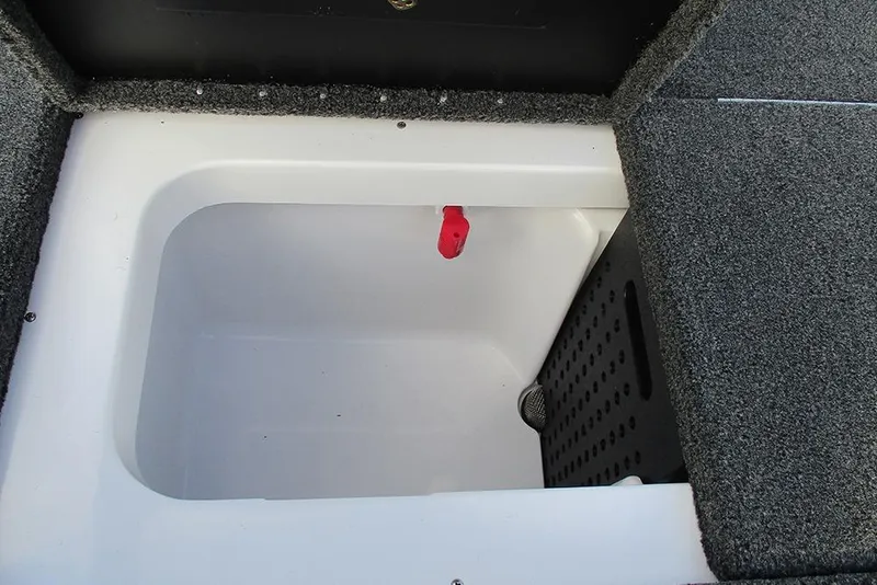 Slide: The Image of 2026 Vexus Defender 189 boat storage compartment with carpeted interior and red latch. - 15