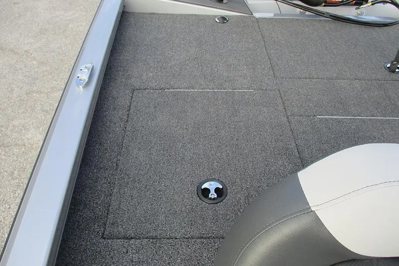 Slide: The Image of 2026 Vexus Defender 189 boat interior with gray carpet and seating. - 16