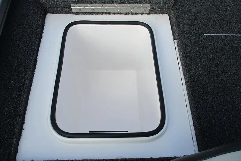 Slide: The Image of Hatch compartment of 2026 Vexus Defender 189 boat, featuring a sleek, white interior. - 18