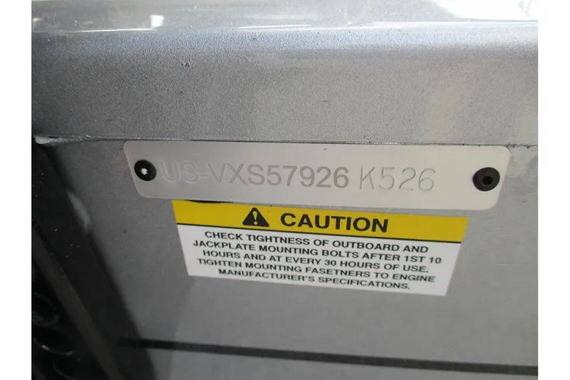 Slide: The Image of 2026 Vexus Defender 189 serial number plate with caution label for bolt maintenance. - 26