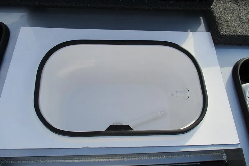 Slide: The Image of Livewell compartment in 2026 Vexus Defender 189 boat, featuring a clean, white interior. - 6
