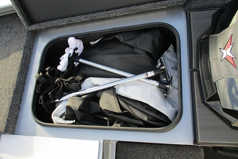 Slide: The Image of Storage compartment of 2026 Vexus Defender 189 boat with equipment and accessories. - 7