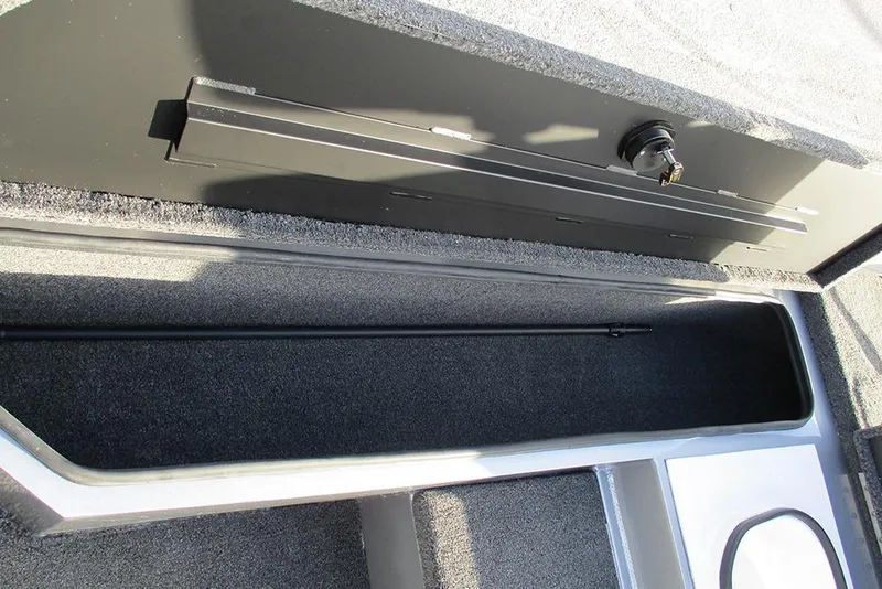 Slide: The Image of Interior storage compartment of 2026 Vexus Defender 189 boat, featuring secure lock mechanism. - 8