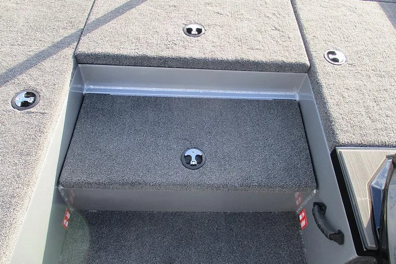 Slide: The Image of 2026 Vexus Defender 189 boat interior with carpeted storage compartments. - 9