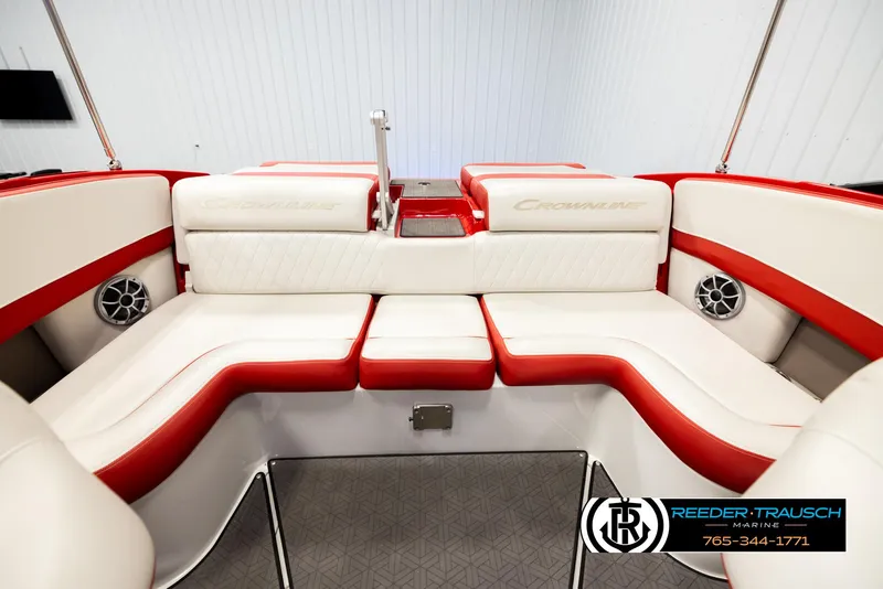 Slide: The Image of 2022 Crownline 220 LPX boat interior with red and white seating, featuring speakers. - 20