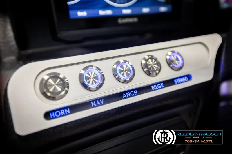 Slide: The Image of Control panel of 2022 Crownline 220 LPX boat with labeled buttons. - 29