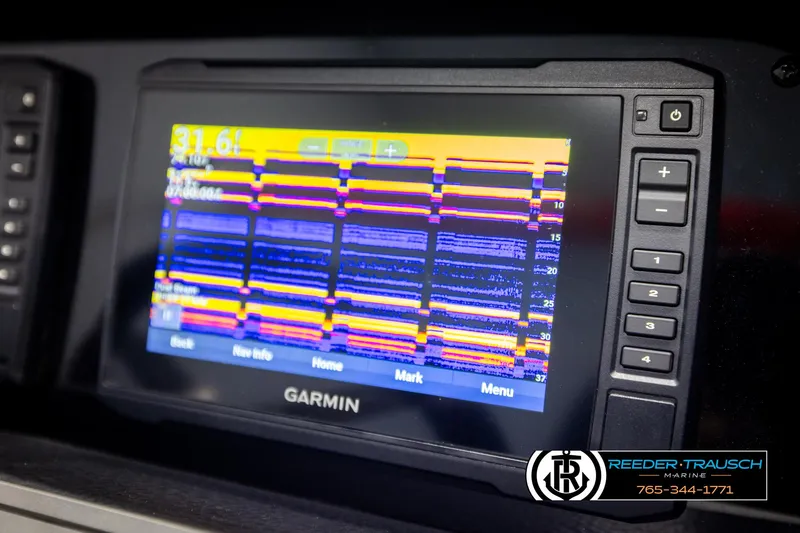 Slide: The Image of Garmin marine display on 2022 Crownline 220 LPX boat dashboard. - 31