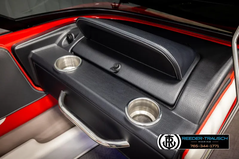 Slide: The Image of Interior of 2022 Crownline 220 LPX boat with cup holders and storage compartment. - 34