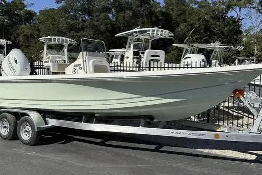 The Image of 2026 Bulls Bay 2200 boat on trailer, parked outdoors with other boats in background. - 0