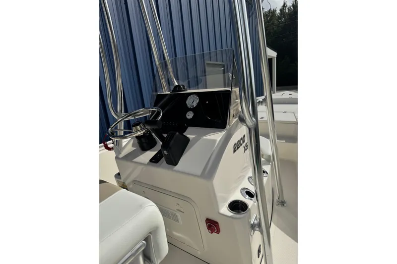 Slide: The Image of 2026 Bulls Bay 2200 boat console with steering wheel and gauges. - 4