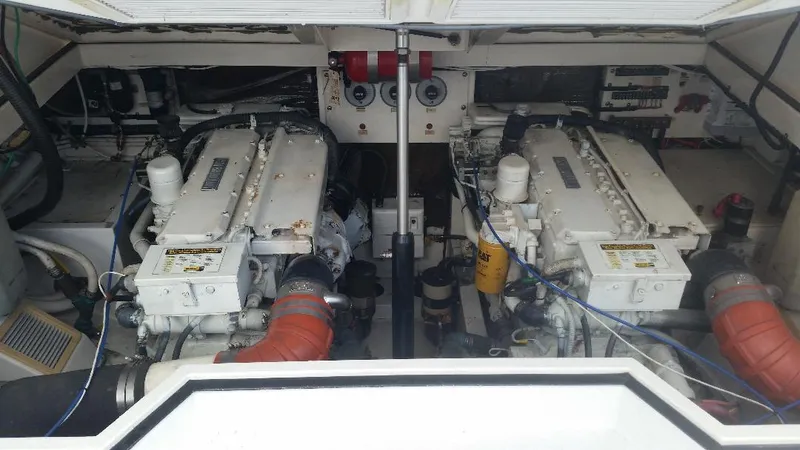 Slide: The Image of Engine compartment of a 1998 Cabo 31 Express with Tower. - 29